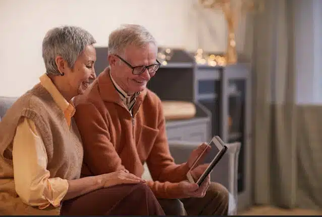 Couple holding iPad