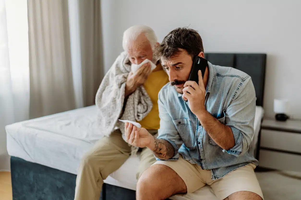 Son taking care of his father because of virus sypmtoms