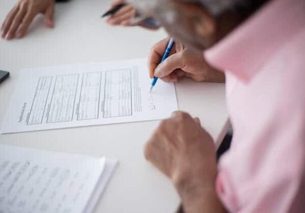 Woman filling out form Woman filling out form